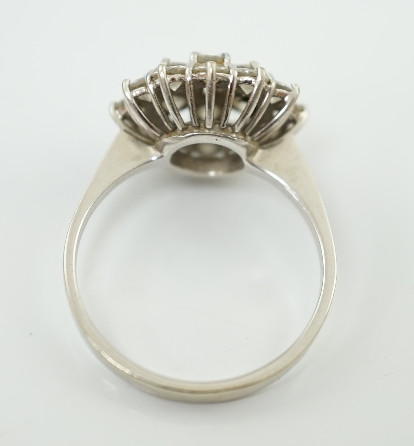 An 18ct white gold and diamond set flower head cluster ring